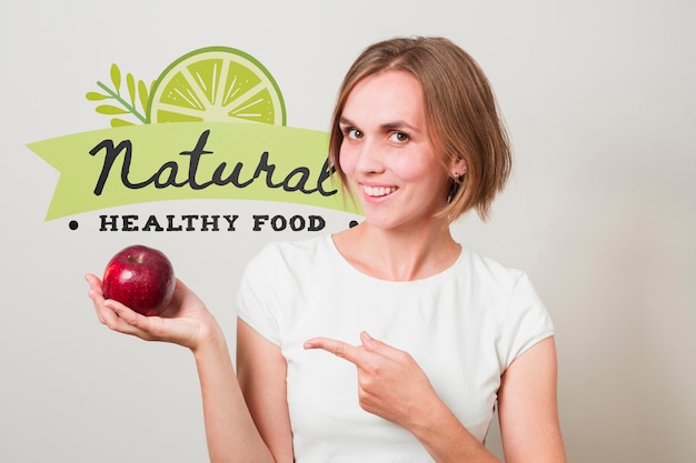 PSD smiling woman holding an apple