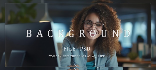 Smiling young woman doing work in front of the computer