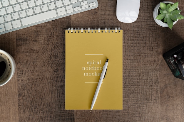 Spiral notebook mockup on office table