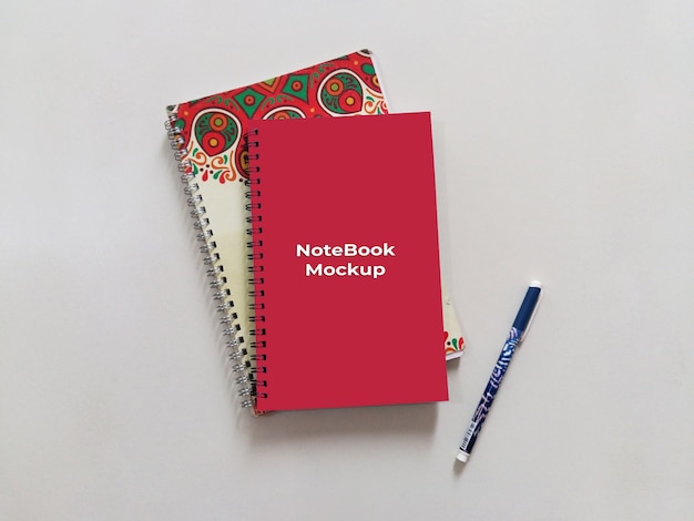 Spiral Portrait Red Notebook Mockup With pen