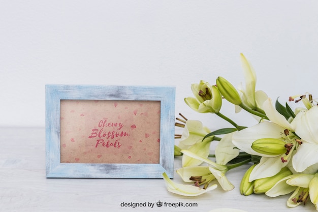 Spring mockup with frame next to flowers