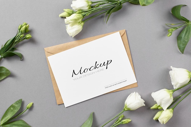 Stationary card mockup with white eustoma flowers on grey background