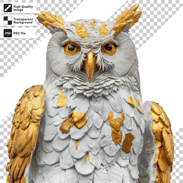 a statue of an owl with gold eyes and gold feathers