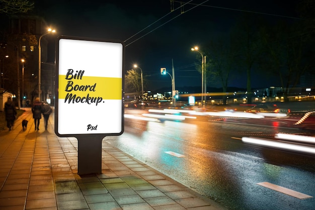 Street billboard mockup in city at night