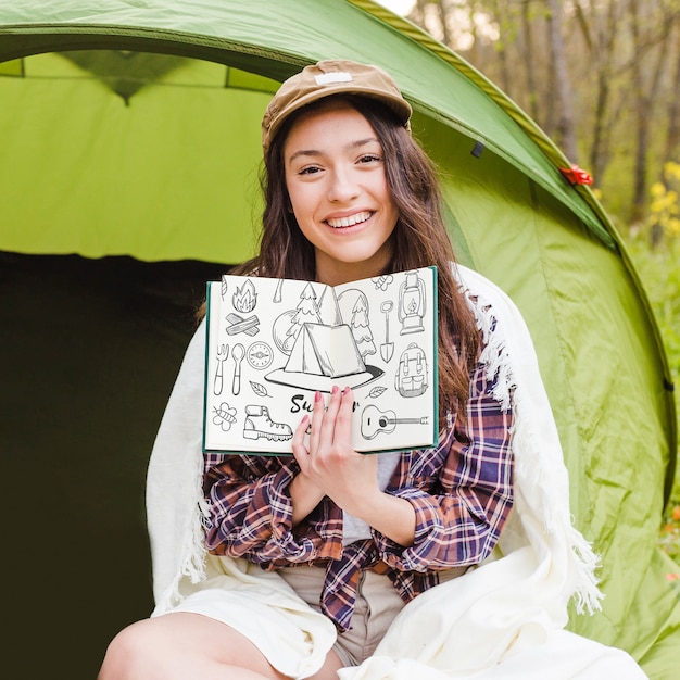 Summer camp mockup with woman showing open book