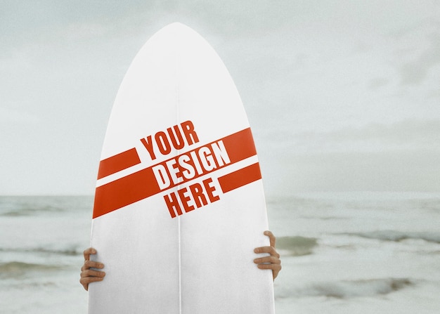 PSD surfer holding a surfboard mockup