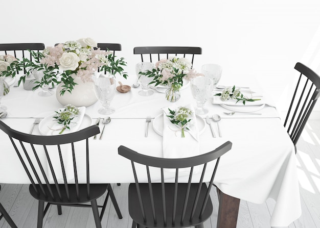 table prepared to eat with cutlery and decorative flowers