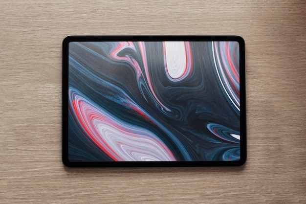 PSD tablet screen mockup psd with fluid art wallpaper flat lay