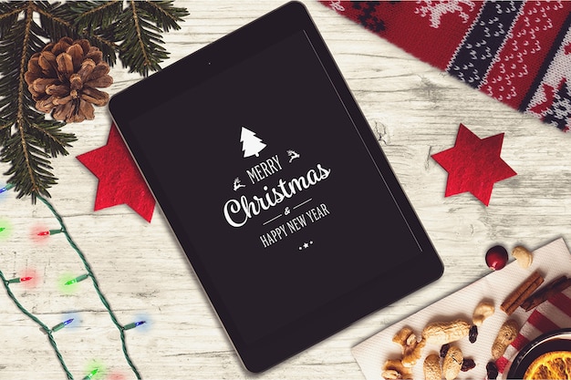 Tablet screen mockup with christmas design