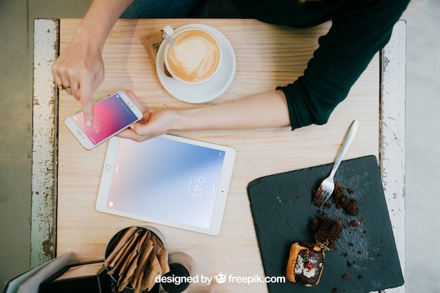 Tablet and smartphone mockup with top view of desk