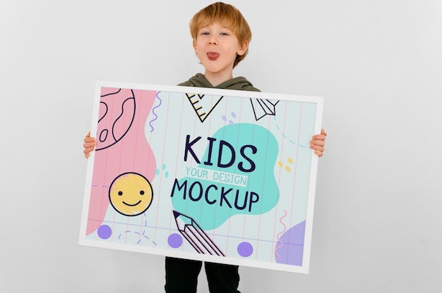 PSD talented kid holding a mock-up drawing