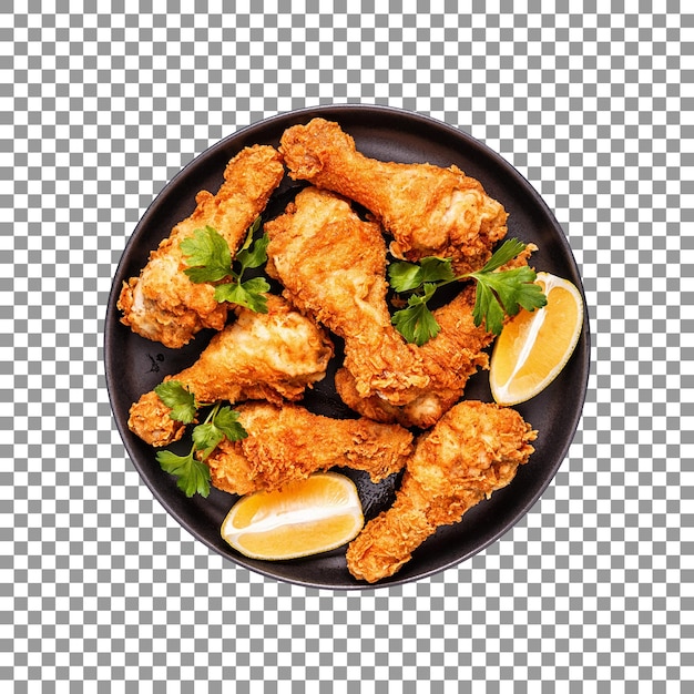 Tasty fried chicken legs with wedge lemon slices isolated on transparent background