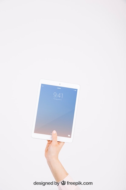 Technology mockup with hand showing tablet