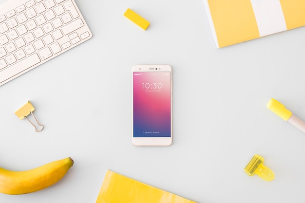 Technology and workspace mockup with smartphone