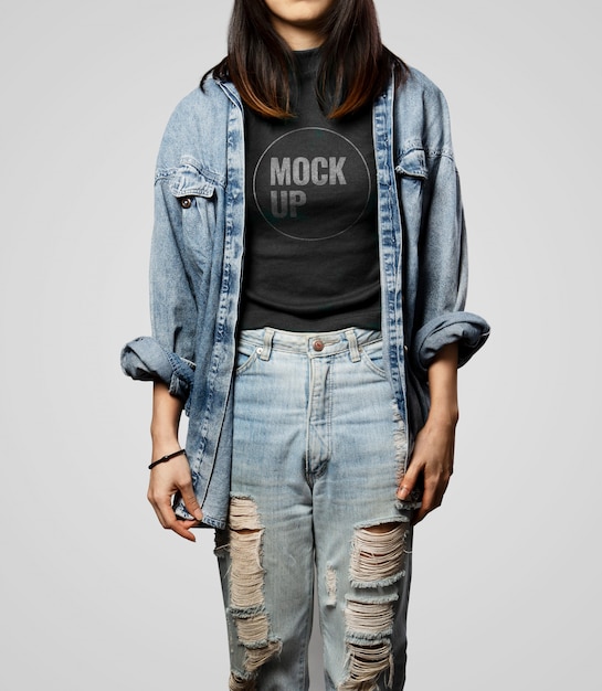 Teen girl wearing black T-shirt mockup and denim outfit