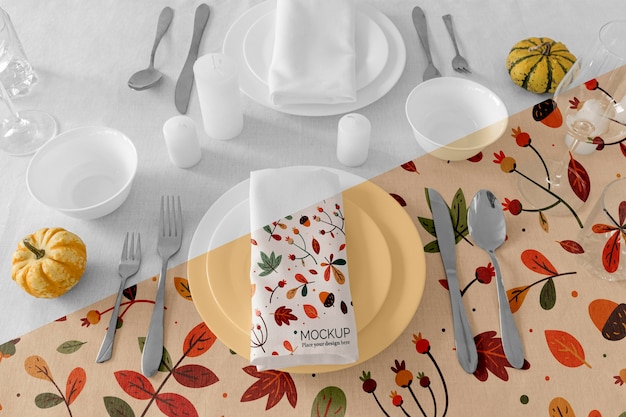 PSD thanksgiving dinner table arrangement with napkin on plates and cutlery