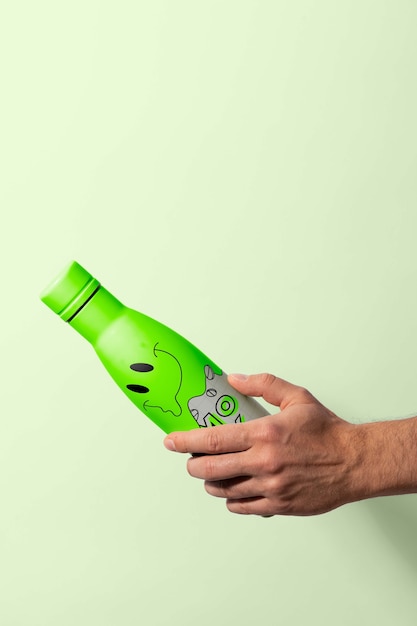 Thermo bottle mockup held in hand