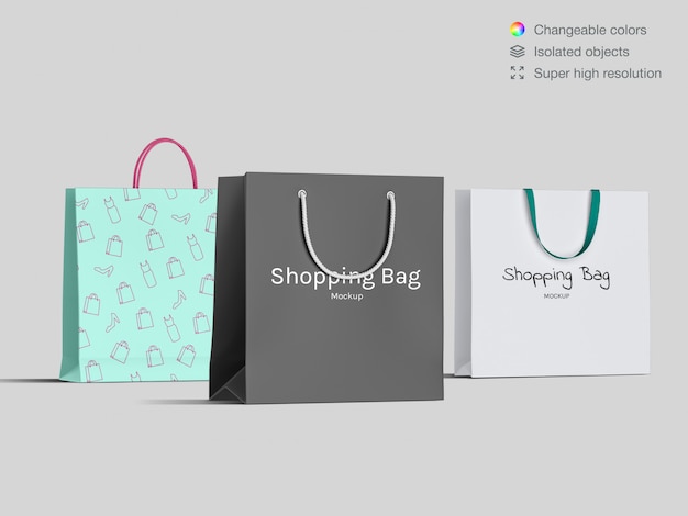 Three realistic front view shopping paper bags mockup template