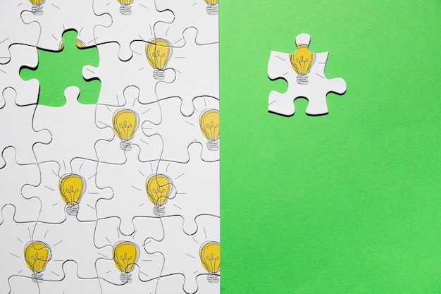 PSD top view arrangement with puzzle on green background