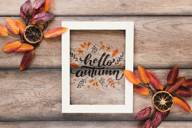 Top view autumn mock-up on wooden background