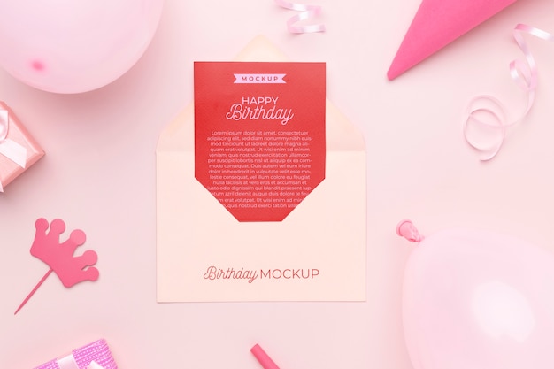 Top view of birthday invitation mock-up with balloons