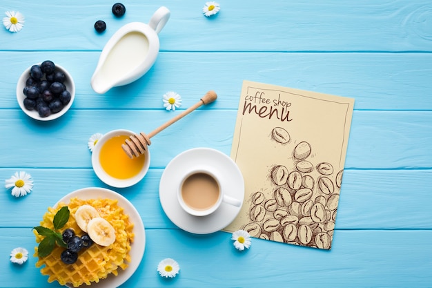 Top view of breakfast food with waffles and coffee