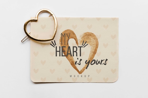 Top view of card with heart-shaped golden pin