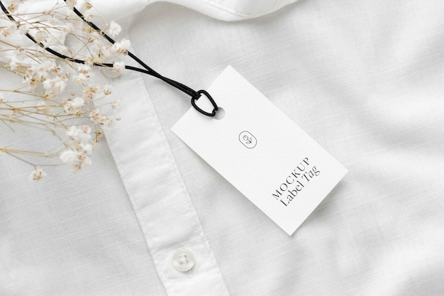 Top view of clothing label on white shirt fabric