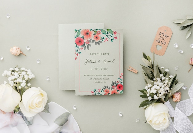 Top view composition of wedding elements with invitation mock-up