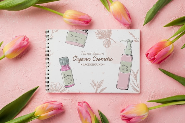 Top view cosmetics mockup with flowers