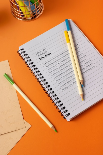 Top view of journal mock-up with colorful stationery