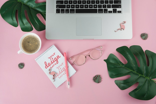 Top view laptop on pink background