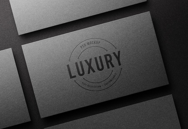 Top view logo mockup on silver business card with letterpress effect