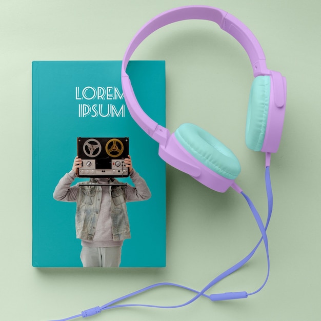 Top view music book cover mock-up arrangement with headphones