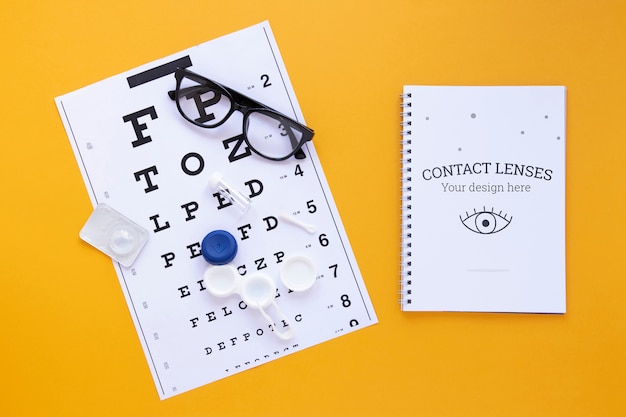 Top view optics still life arrangement on yellow background