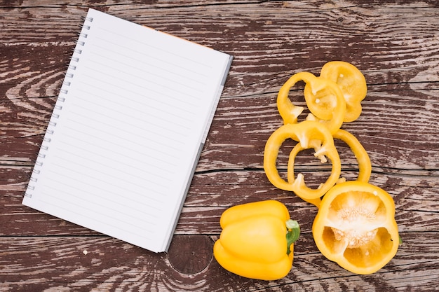 Top view peppers with notebook