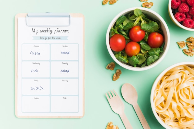 PSD top view of planned meals with bowls and notepad