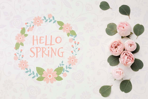 Top view of spring roses and leaves