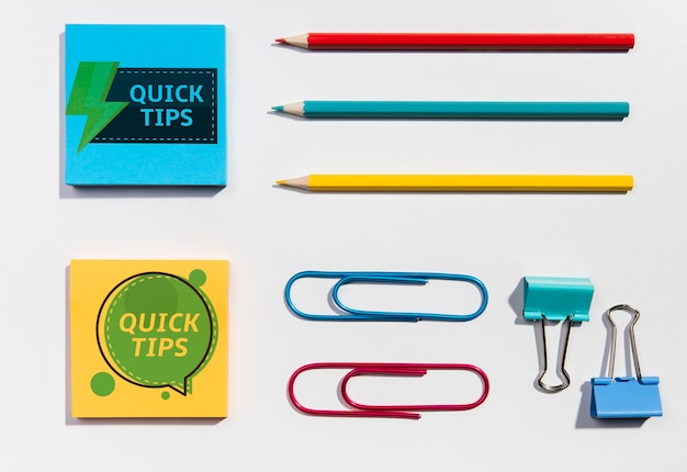 Top view sticky-notes and pencils knolling desk concept