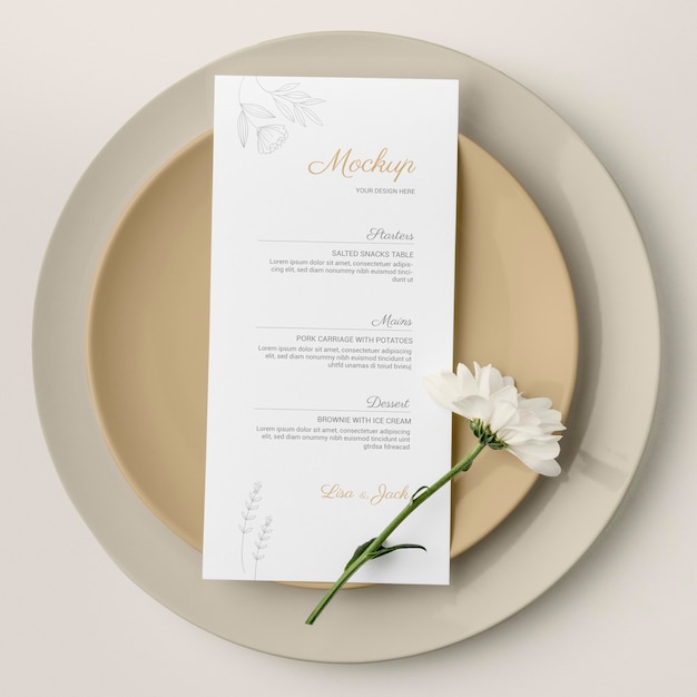 Top view of table arrangement with spring flower and menu mock-up on plates