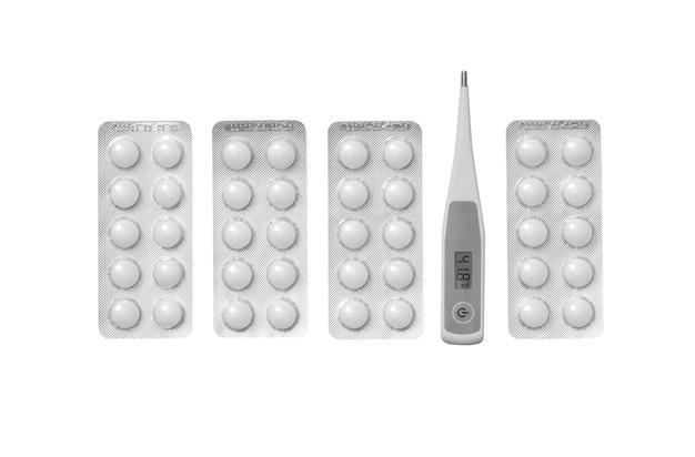 Top view on thermometer with pills