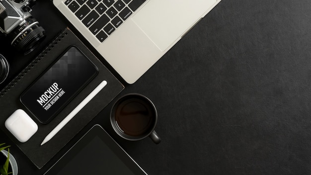 Top view of worktable with mock up smartphone