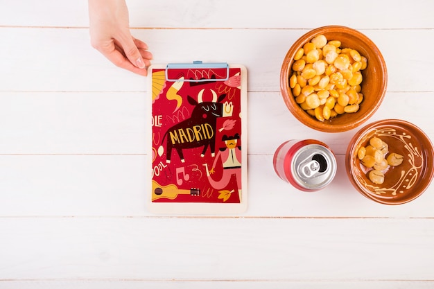 Traditional spanish food mockup with clipboard