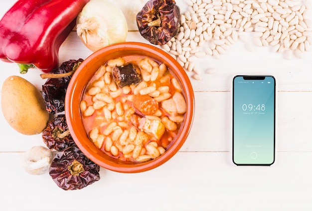 Traditional spanish food mockup with smartphone