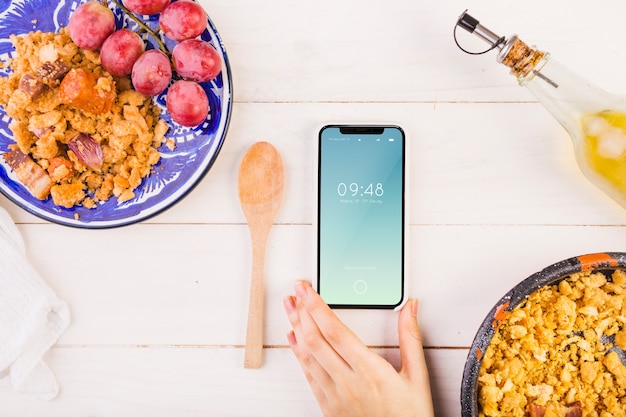 PSD traditional spanish food mockup with smartphone