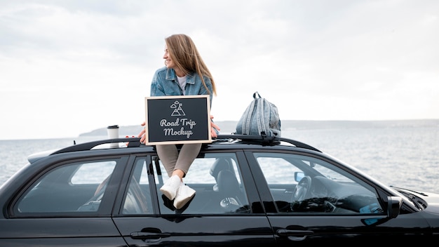 Traveler holding a mock-up chalkboard