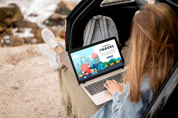 Traveler holding a mock-up laptop