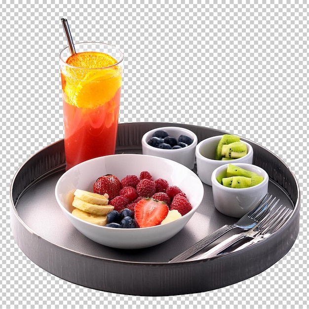 a tray with fruit and a glass of juice and a spoon