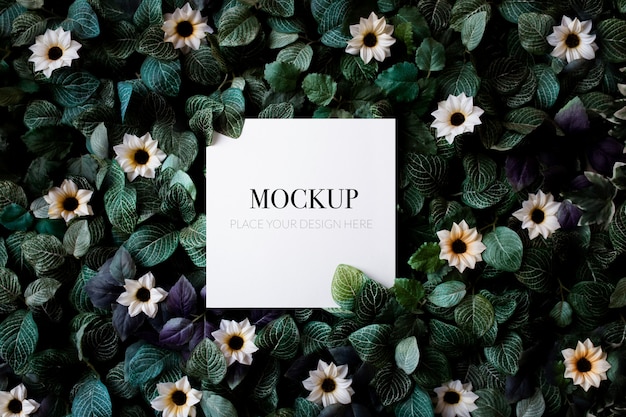 Tropical foliage background with daisies mockup 