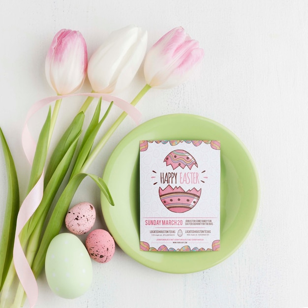 Tulips and eggs on table